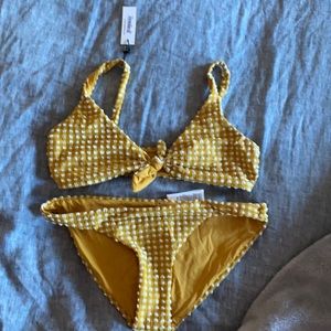 Bikini never worn. top is 10 and bottom is S/M